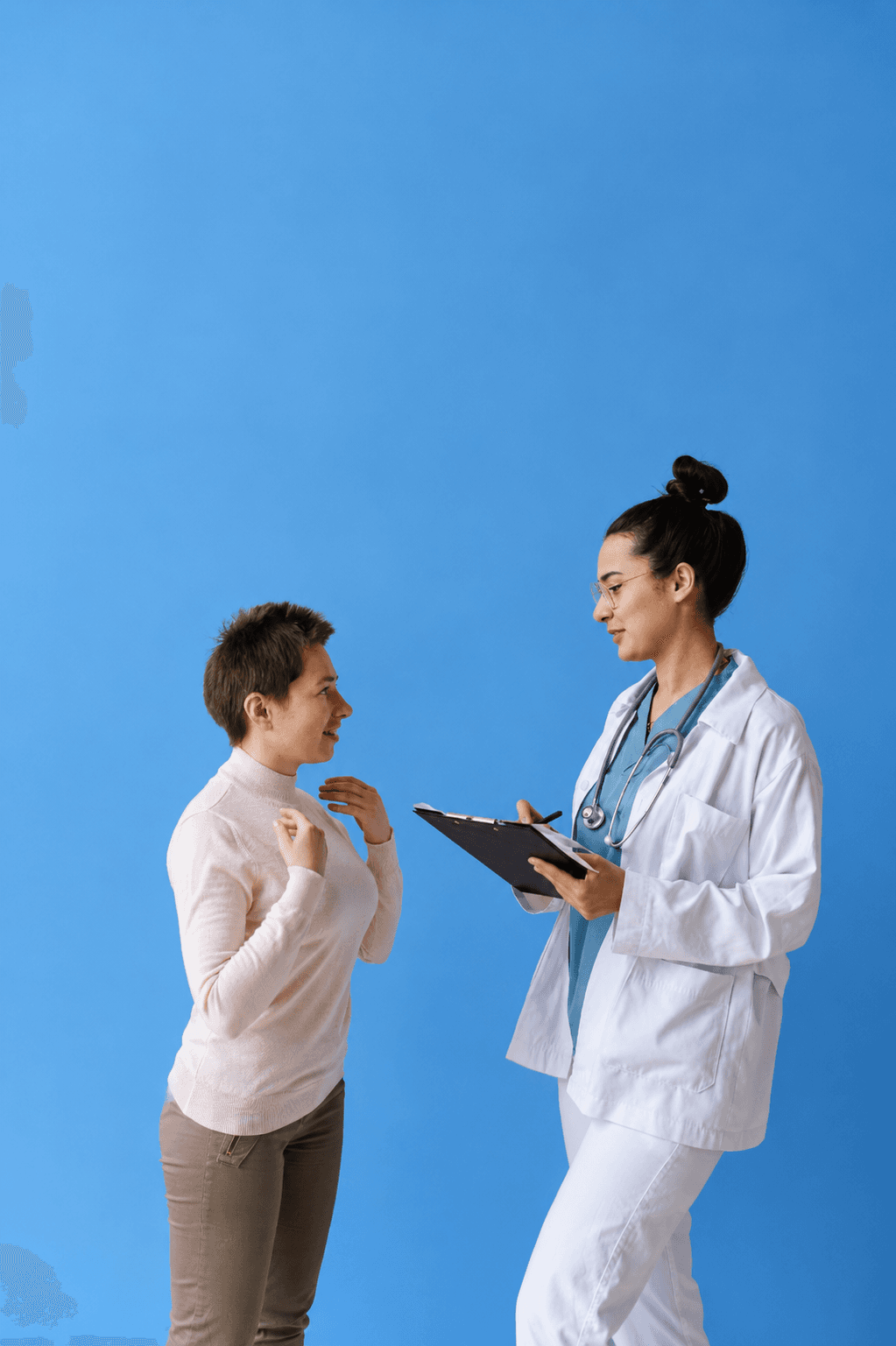 A clinician talking with a patient during a visit